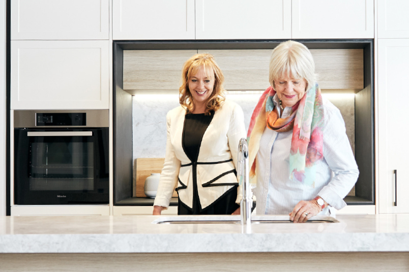 One Fell Swoop - woman and her mother inspecting the kitchen in a new retirement apartment