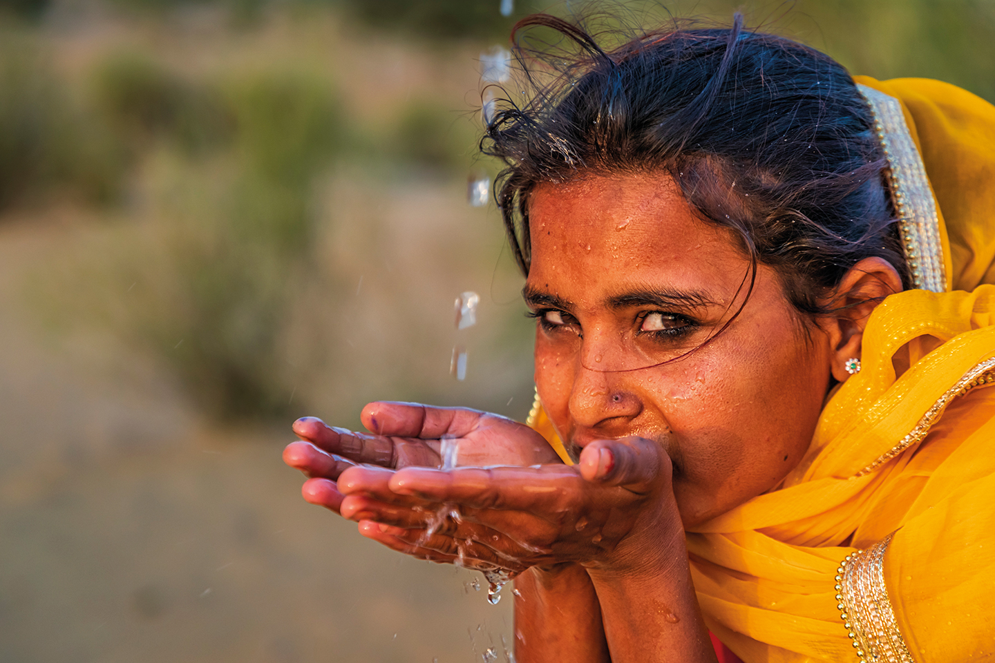 Indian girl drinking water