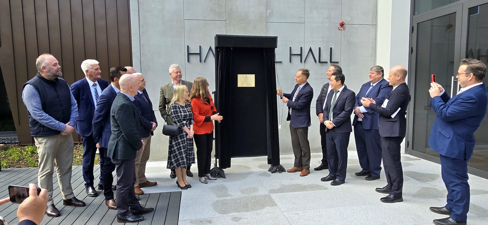 Image of people at plaque unveiling