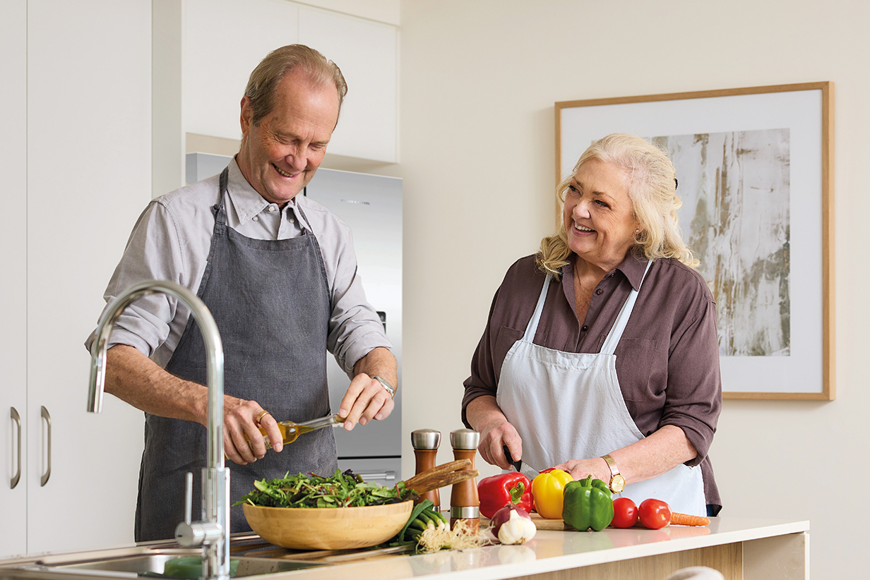 One Fell Swoop - senior couple cooking a meal in a kitchen